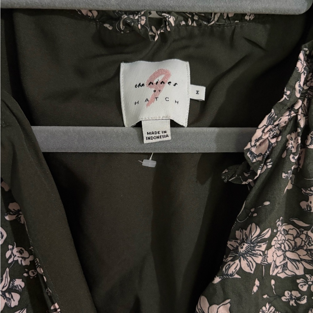 Floral maxi maternity dress, pink flowers on a dark green dress.